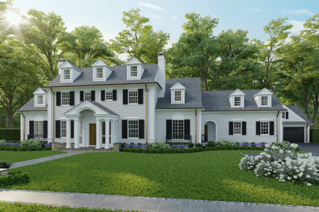 Large white Colonial-style home in Wellesley, Massachusetts, with black shutters, multiple dormer windows, a columned front entrance, attached garage, and professionally landscaped lawn.